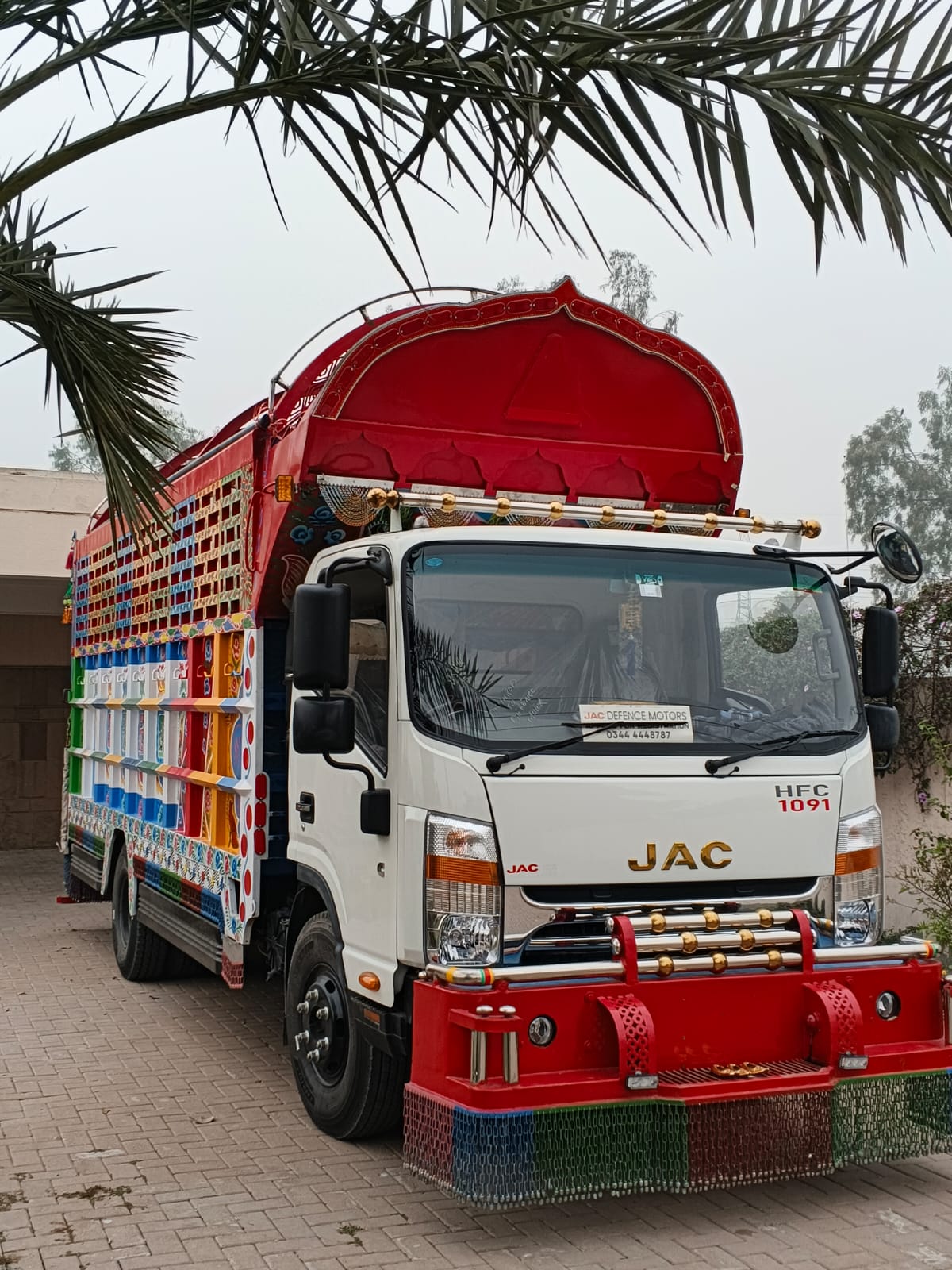 Moving truck carrying packed goods for relocation